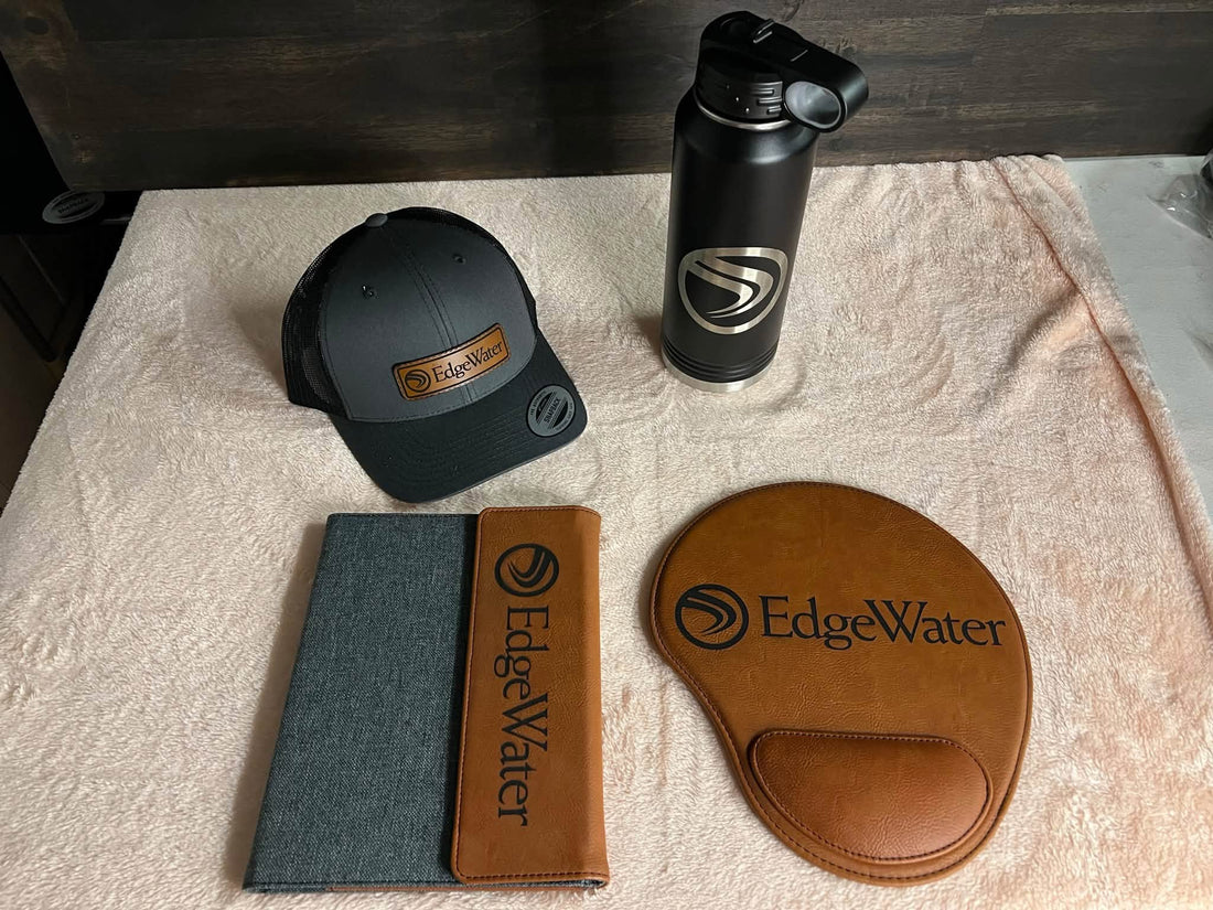 Coordinated EdgeWater customer gear including a custom patch hat, engraved bottle and engraved accessories
